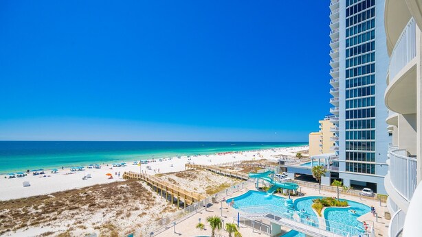 A resort with a beach view, multiple swimming pools, and a high-rise building. - Phoenix Gulf Shores Ii 405 4 Bedroom Condo (Gulf Shores)