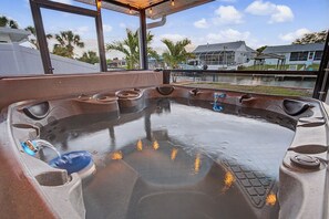 A hot tub with a view of a residential area and a body of water. - Waterfront Fun Retreat | Pool with Slide, Hot Tub, Dock + Game Room (Apollo Beach)