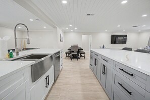 Fridge, microwave, cookware/dishes/utensils - Canal Front Getaway | Pool, Dock, Game Room + Screened Porch (Port Richey)