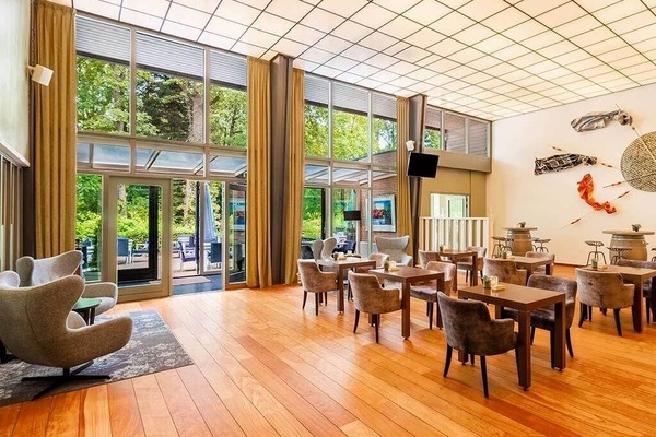Start your morning in a sunlit dining room with garden views.