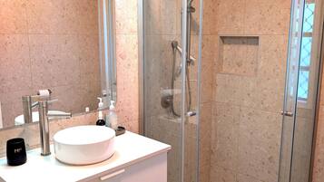 Shower, hair dryer, towels, soap
