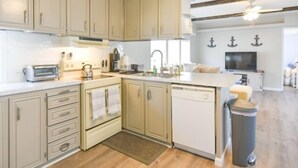 A kitchen with wooden cabinets, a dishwasher, a sink, and a stove. - 3 BR 2 BA located in the Montego Bay Community, 2 Pools Tennis. Pets welcome (Ocean City)