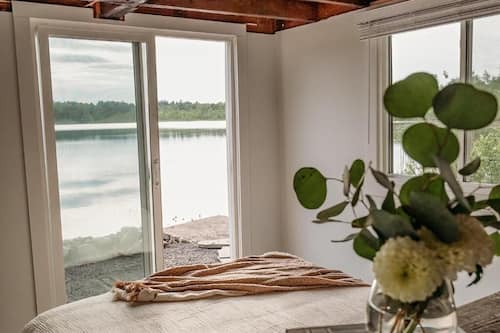 Deluxe Cottage, Patio, Lake View | Hypo-allergenic bedding, blackout drapes, iron/ironing board, free WiFi