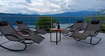 Modern house in the woods with a view of the Millstattersee