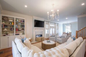 TV, fireplace, books - The Stones Throw, 4BR Condo by Velvet Ditch Villas (Oxford)