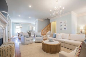 TV, fireplace, books - The Stones Throw, 4BR Condo by Velvet Ditch Villas (Oxford)