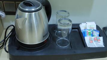 Family Triple Room, City View | Coffee and/or coffee maker