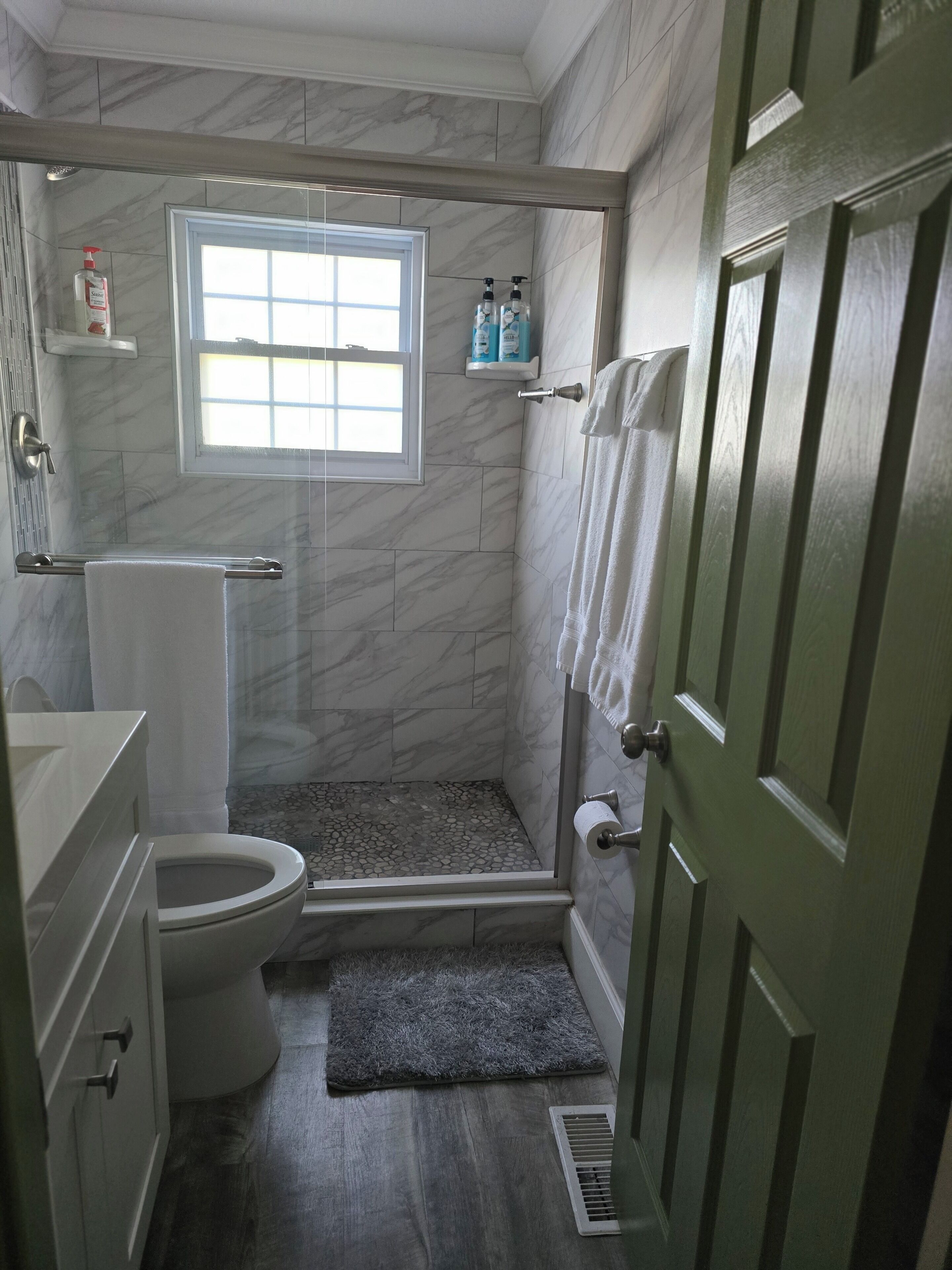 Shower, hair dryer, towels, soap