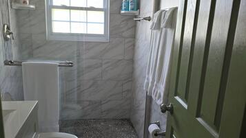 Shower, hair dryer, towels, soap