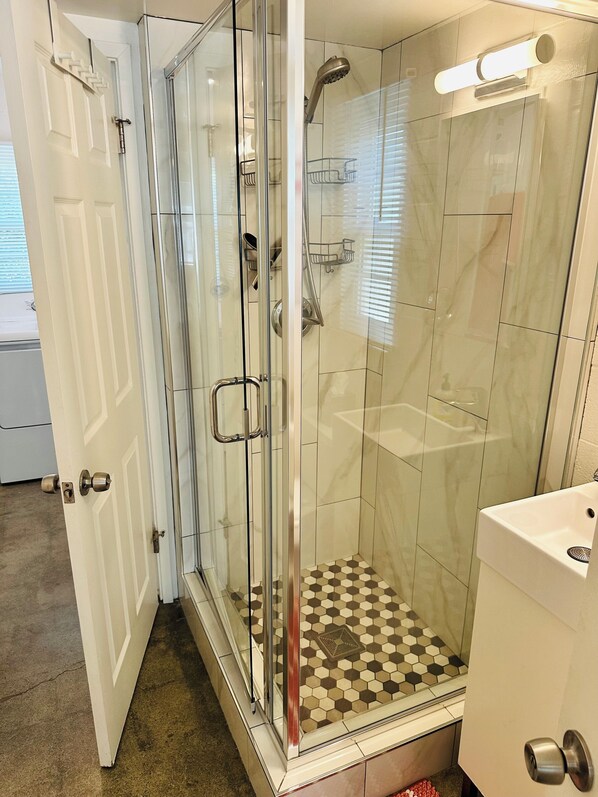 Shower, hair dryer, towels, soap