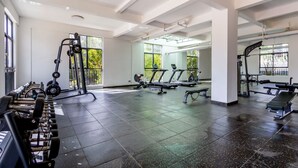 A gym with weightlifting equipment, treadmills, and exercise machines. - 1 Bedroom in Westlands, Nairobi ,parking, WiFi,Gym (Nairobi)