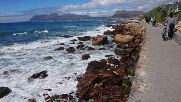 A coastal road with rocky outcrops and a clear view of the ocean. - Adventure Cape Town 1 (Cape Town)