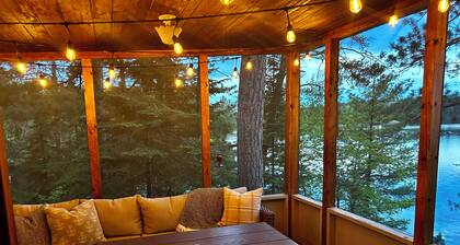 New - Cozy lakefront cabin on private wooded peninsula with bunkhouse and sauna