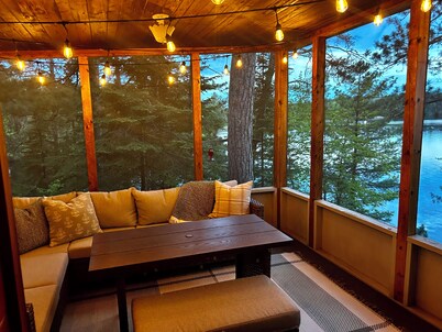 New - Cozy lakefront cabin on private wooded peninsula with bunkhouse and sauna