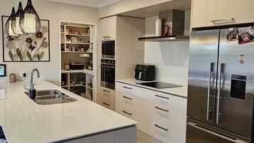 Coffee/tea maker, fridge, microwave, oven