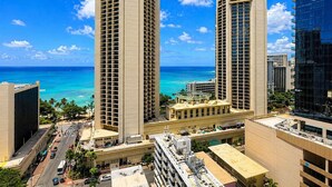 A high-rise hotel with multiple floors, a pool, and a view of the ocean. - Waikiki Ocean Luxe Retreat | Panoramic Views (Honolulu)