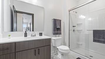 Shower, hair dryer, towels, soap