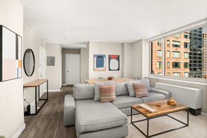Living area - Spacious 2BR/2BA Apartment in Prime Midtown West (New York)