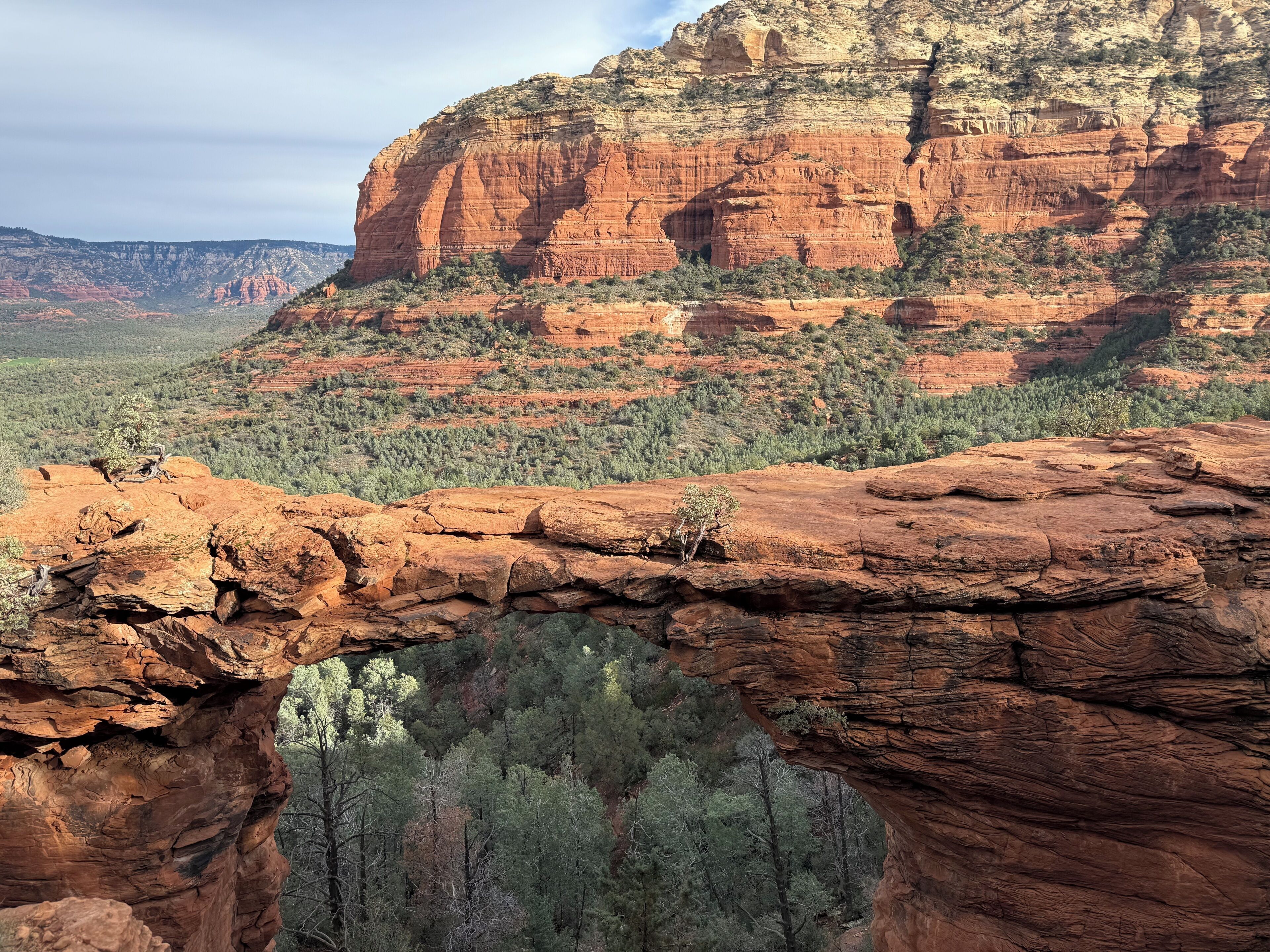 A natural rock formation with a narrow passageway.