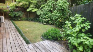 Property grounds - Romantic Log Cabin Retreat with outdoor bath set amongst the trees (Waitakere City)