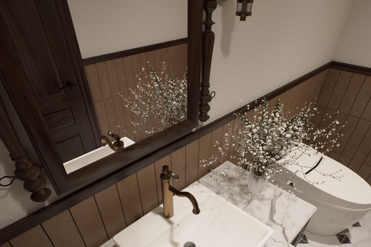 Une salle de bain avec un lavabo blanc, un miroir et un vase contenant des fleurs blanches.
