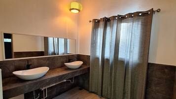 Shower, towels, soap, toilet paper