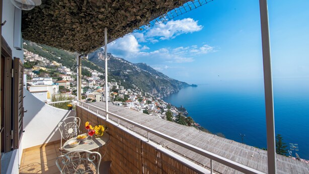 A balcony with a view of a coastal town and the sea. - The Seagull - Tradewinds (Praiano)