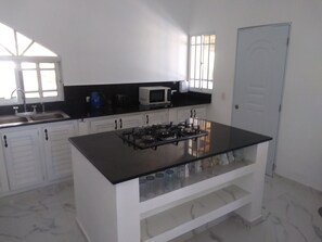 Private kitchen - Delightful ground floor 2-bedroom apartment with AC and pool in Playa Encuentro (Playa Encuentro)