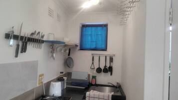 Fridge, microwave, stovetop, cookware/dishes/utensils