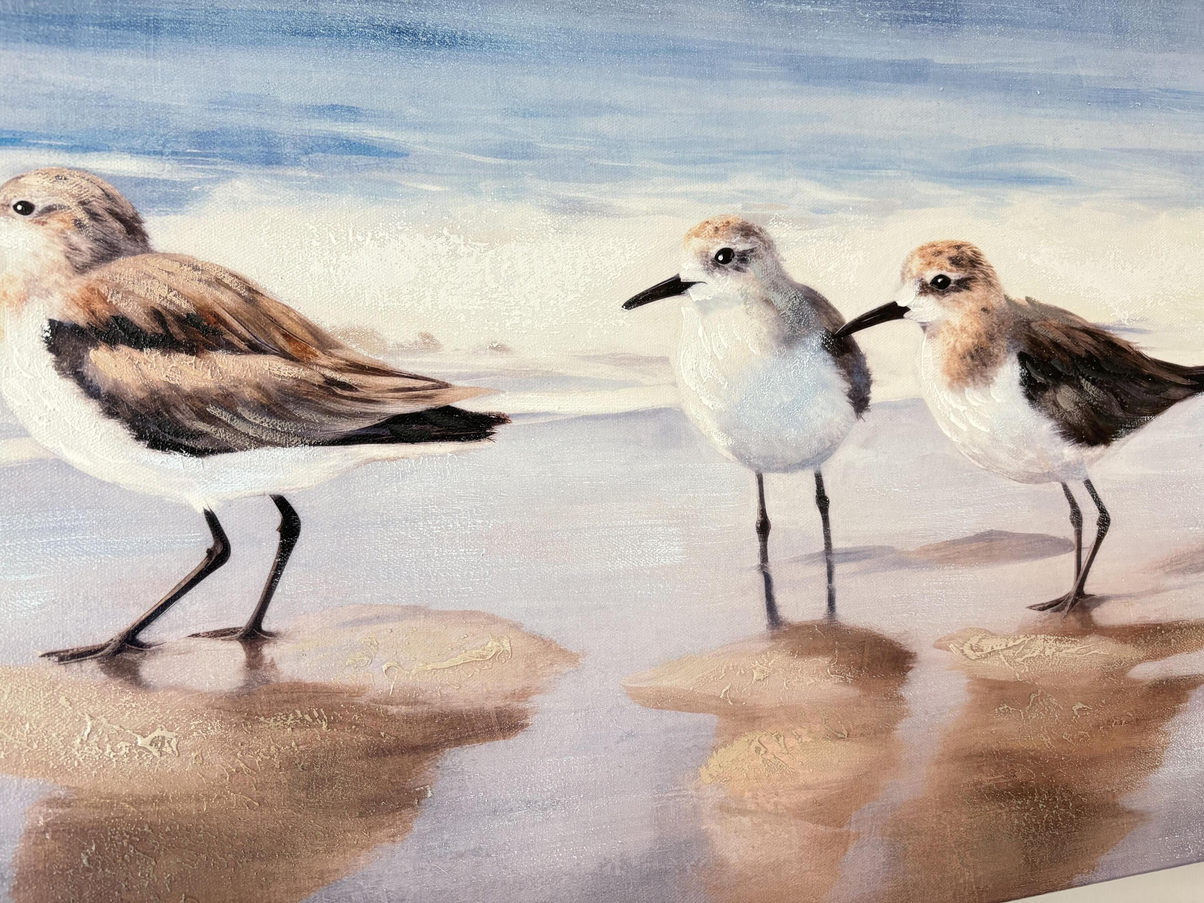 A painting of three birds on a beach.