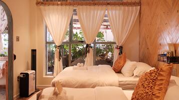 Quadruple Room, Garden View | Blackout drapes, iron/ironing board, free WiFi