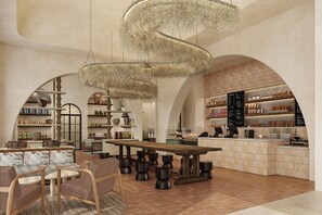 A modern interior with a central wooden table, seating area, and a counter with shelves. - Grand Hyatt Los Cabos Resort, Golf & Spa, All-Inclusive (Cabo San Lucas)