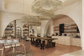 A modern interior with a central wooden table, seating area, and a counter with shelves. - Grand Hyatt Los Cabos Resort, Golf & Spa, All-Inclusive (Cabo San Lucas)