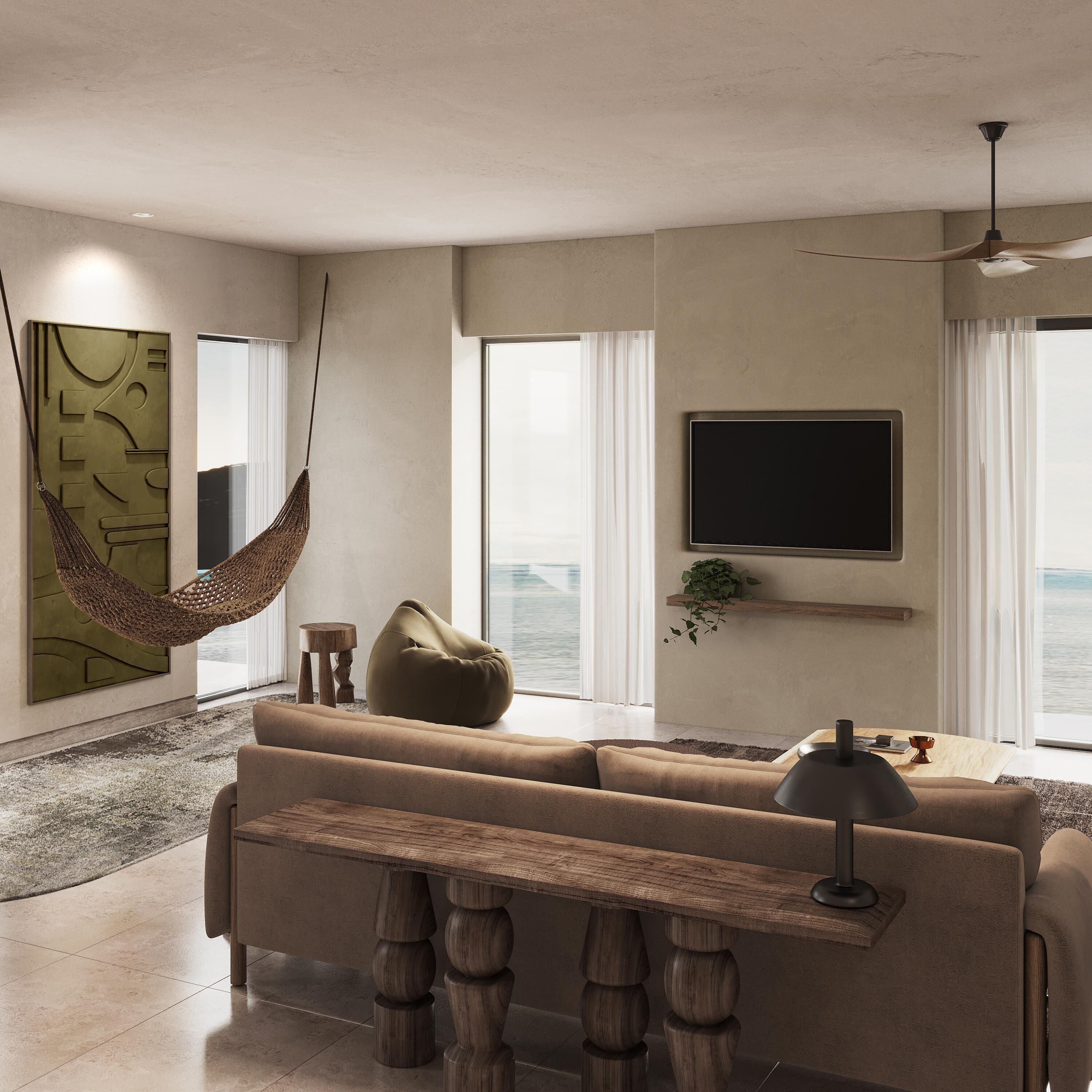 Een moderne woonkamer met een bank, een kruikzak, een hangmat, een televisie en uitzicht op zee.