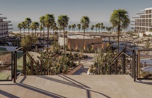 A resort with palm trees, a pool, and a beach view. - Grand Hyatt Los Cabos Resort, Golf & Spa, All-Inclusive (Cabo San Lucas)