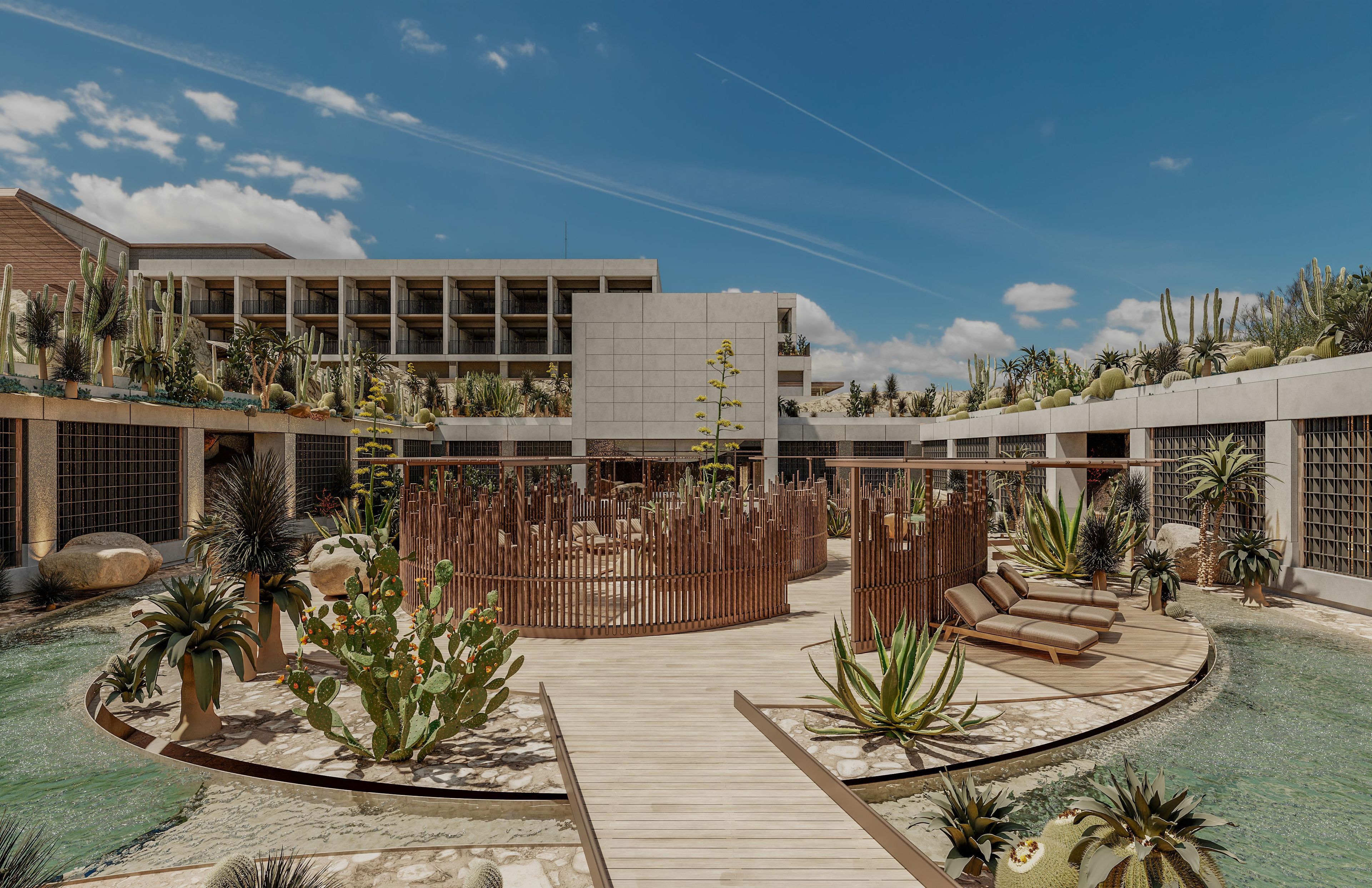 A resort with a pool, wooden deck, and cacti.