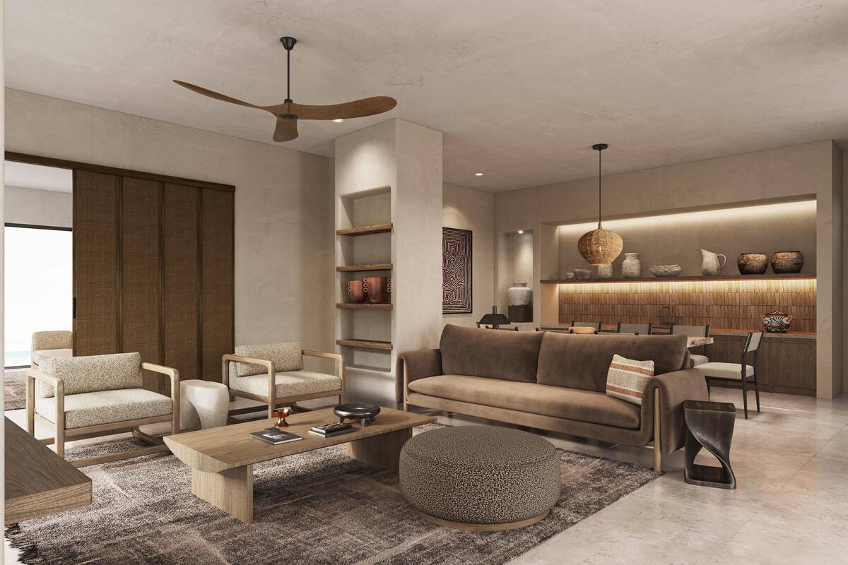 Un salon moderne avec un canapé, des fauteuils, une table basse et un ventilateur de plafond.