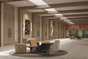 A spacious lobby with a central seating area, a brick wall with cacti, and a modern ceiling design. - Grand Hyatt Los Cabos Resort, Golf & Spa, All-Inclusive (Cabo San Lucas)