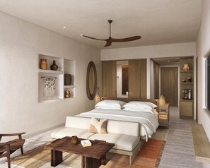 A modern bedroom with a large bed, a ceiling fan, a sofa, a coffee table, and a bathroom visible through a sliding door. - Grand Hyatt Los Cabos Resort, Golf & Spa, All-Inclusive (Cabo San Lucas)