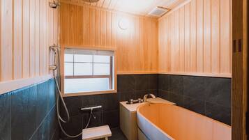 Deluxe Villa, Garden View | Bathroom | Separate tub and shower, hydromassage showerhead, hair dryer, slippers