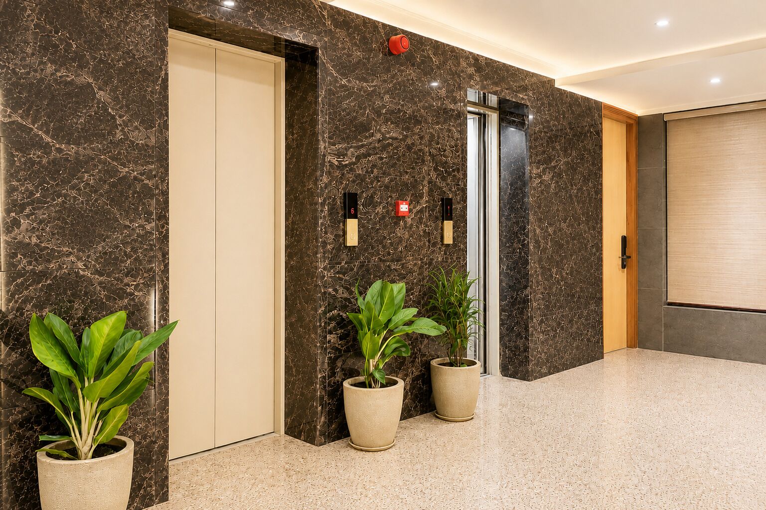 A modern elevator with a digital display, a door, and a potted plant beside it.