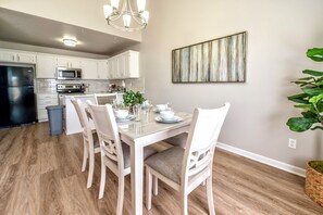 Dining - Galway Street Getaway: clean, comfy Smithville home in a quiet neighborhood. 2 bedrooms + bonus basement sleeper sofa, 3 full baths (primary ensuite + basement bath). KC attractions are typically 30–45 min away. (Smithville)