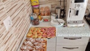 A buffet table with various pastries and baked goods. - B&b Eden Ogliastra  (Tortolì)
