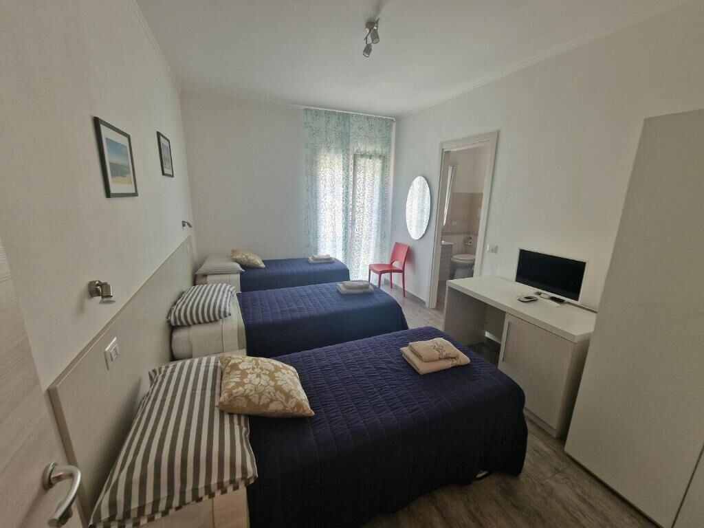 Quarto triplo conforto, vista para o jardim