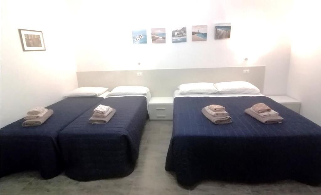 Quarto triplo família, vista para o pátio