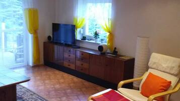 Smart TV, DVD player, foosball, books