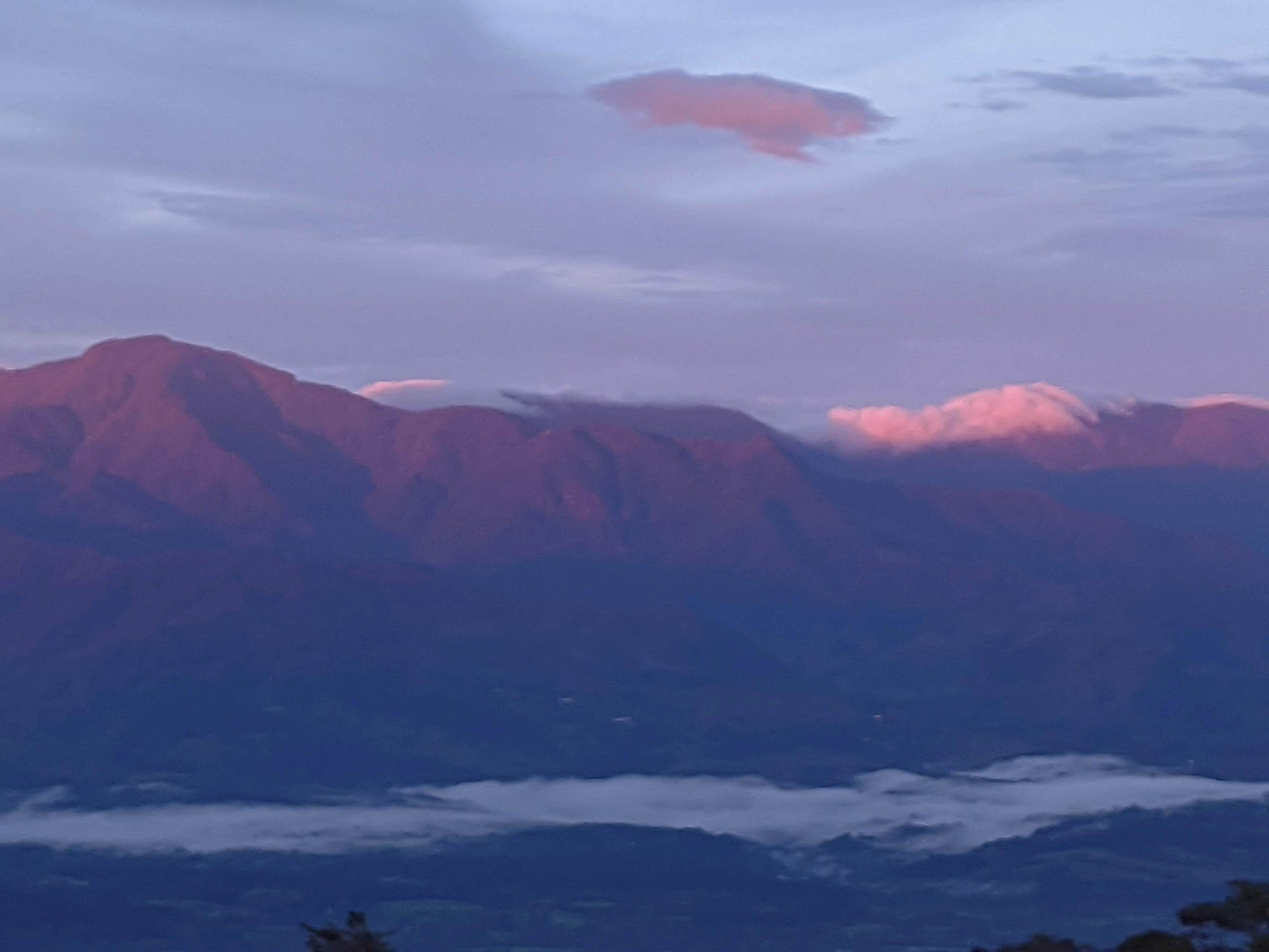 A mountain range with a cloud-covered valley.