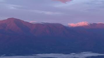 A mountain range with a cloud-covered valley.
