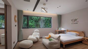 A modern bedroom with a large window, a bed, a desk, and a chair.