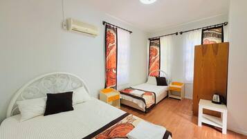 Family Room, Balcony, Mountain View | Premium bedding, minibar, individually decorated, desk